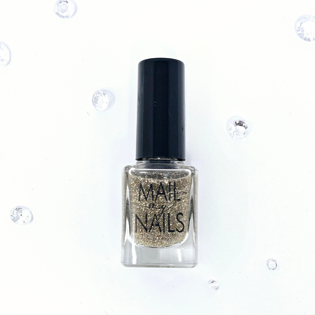 glitter gold nail polish in bottle