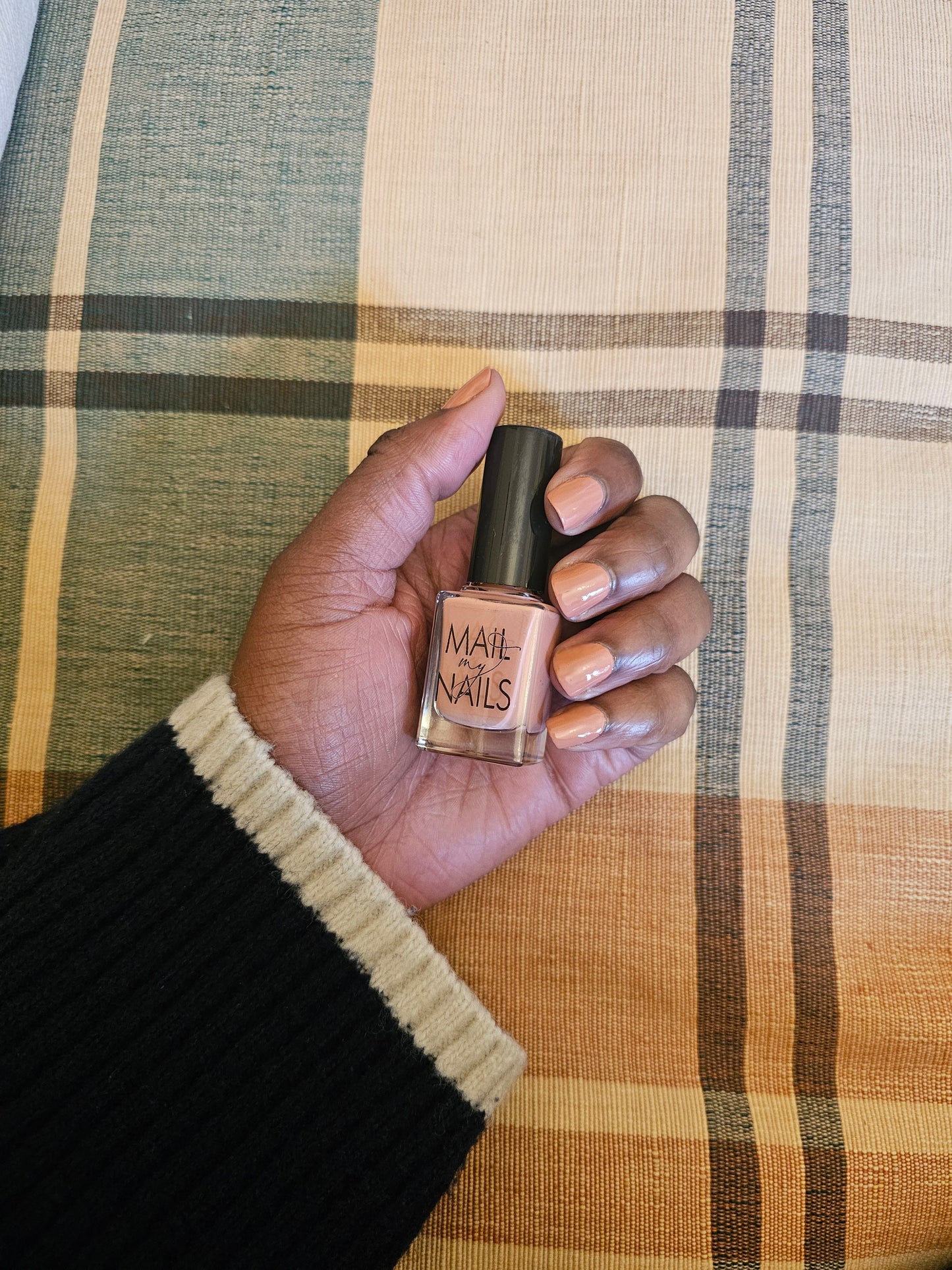 Swatch of peach nude nail polish