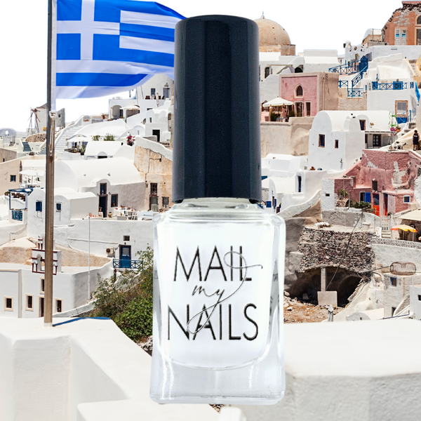 white nail polish with santorini views in the background
