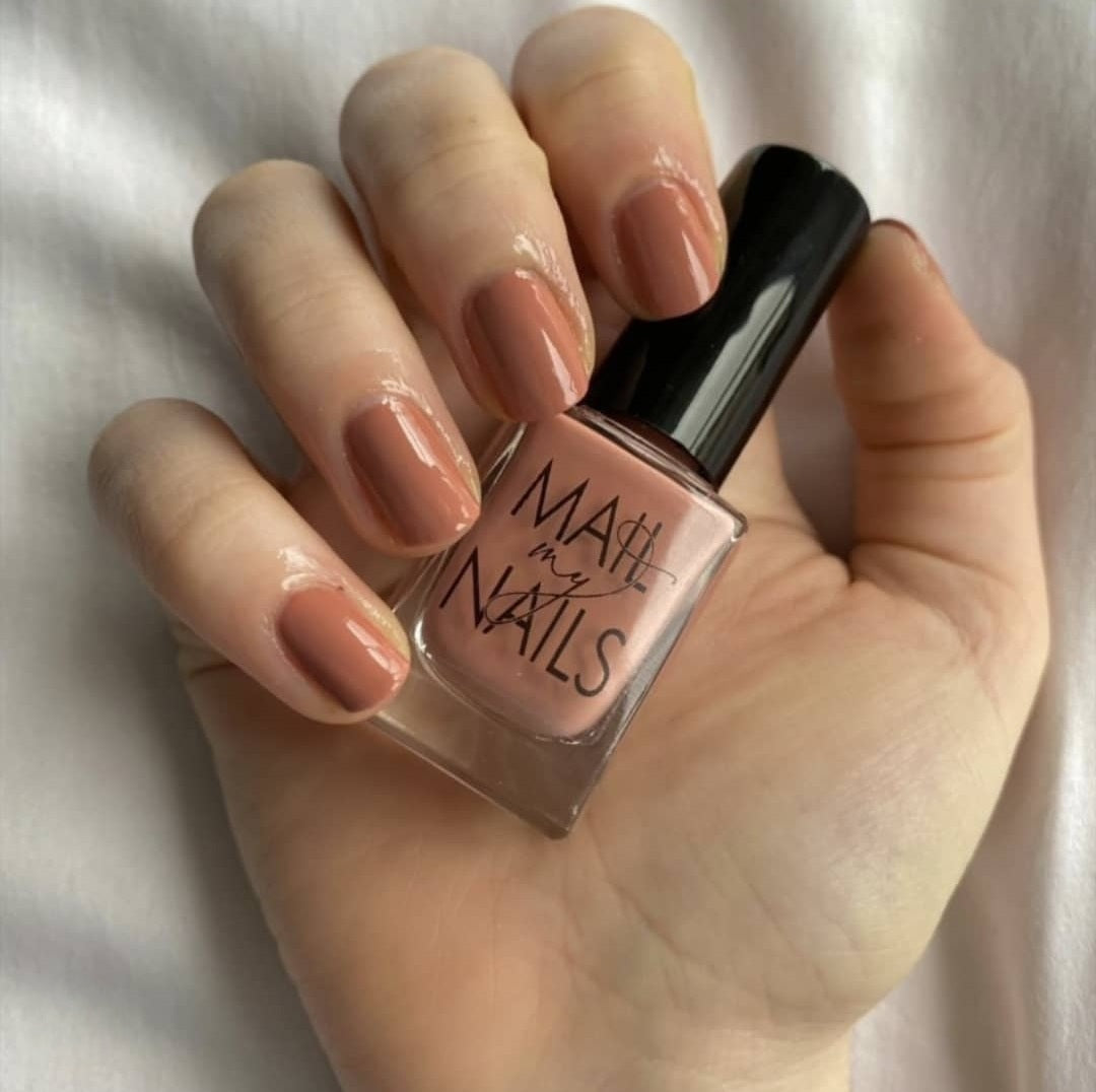 Swatch of pink nude nail polish.